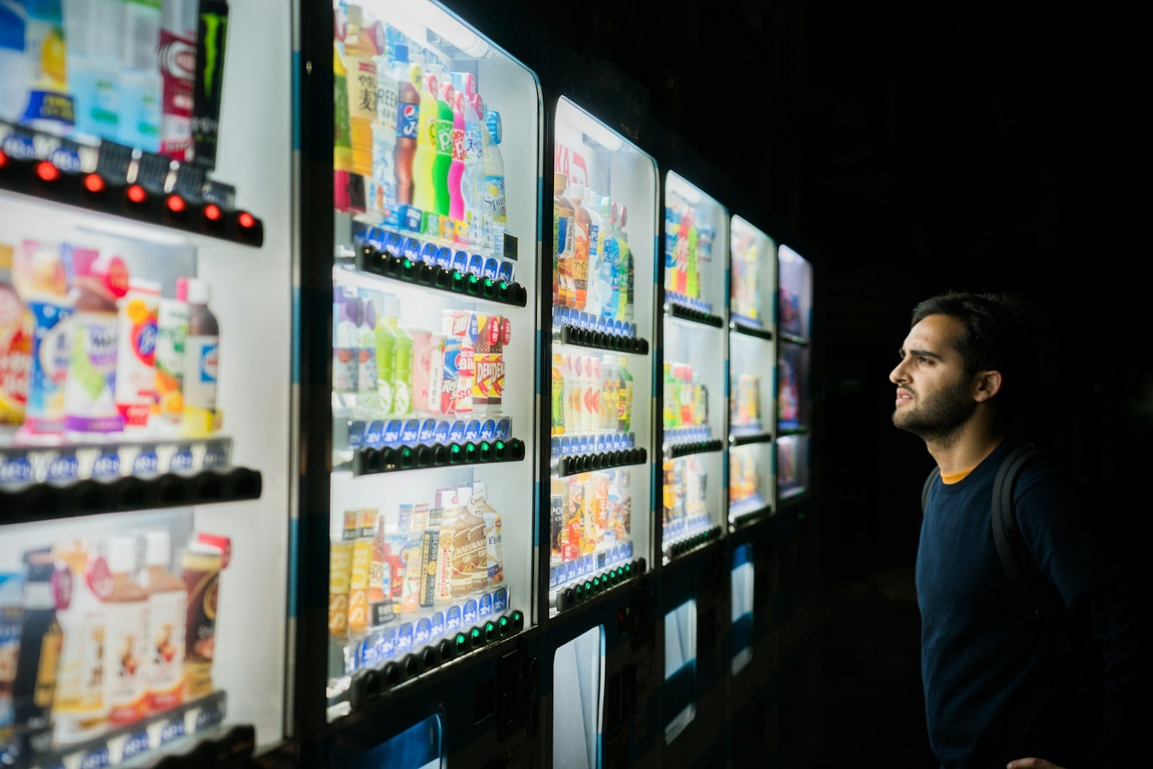 Close-up of a slot-machine with drinks and chocolate bars inside it